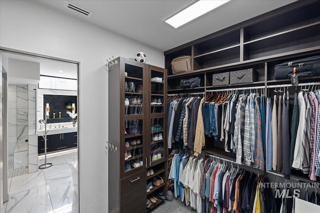 1865 E Lone Shore Ln, Eagle, ID 83616 - walk in closet featuring visible vents and marble finish floor
