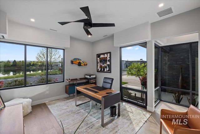 1865 E Lone Shore Ln, Eagle, ID 83616 - home office featuring ceiling fan, recessed lighting, baseboards, a water view, and visible vents