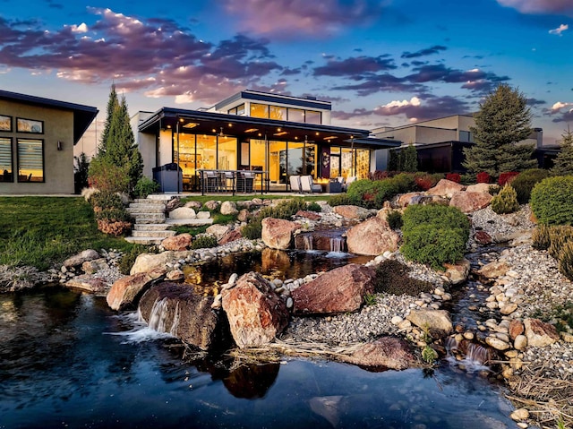 1865 E Lone Shore Ln, Eagle, ID 83616 - rear view of property with a garden pond
