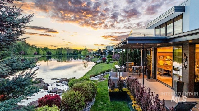 1865 E Lone Shore Ln, Eagle, ID 83616 - yard at dusk featuring a water view and a patio