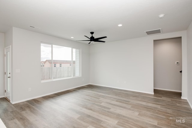 empty room featuring ceiling fan, recessed lighting, visible vents, and light wood-style floors