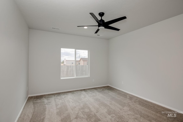 unfurnished room with carpet flooring, visible vents, baseboards, ceiling fan, and recessed lighting