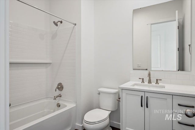bathroom featuring toilet, vanity, and shower / bathing tub combination