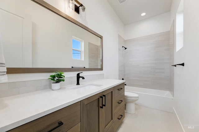 12507 S Lenora Pl, Nampa, ID 83686 - bathroom with tile patterned flooring, vanity, toilet, visible vents, and washtub / shower combination