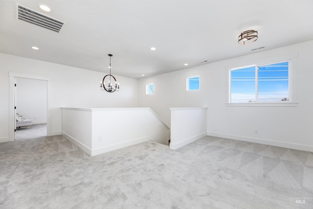 12507 S Lenora Pl, Nampa, ID 83686 - unfurnished room with visible vents, recessed lighting, a notable chandelier, and light carpet