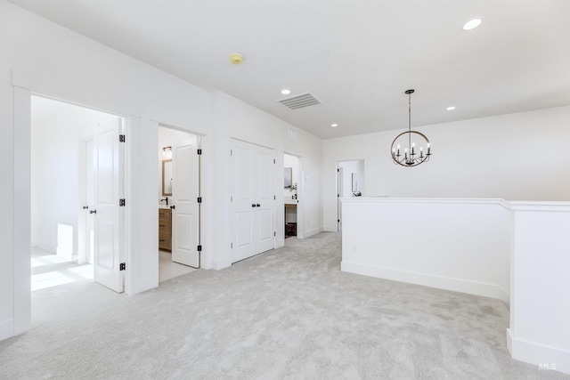 12507 S Lenora Pl, Nampa, ID 83686 - carpeted spare room with baseboards, visible vents, recessed lighting, and an inviting chandelier