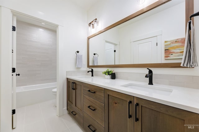 12507 S Lenora Pl, Nampa, ID 83686 - full bath featuring toilet, double vanity, a sink, and tile patterned floors