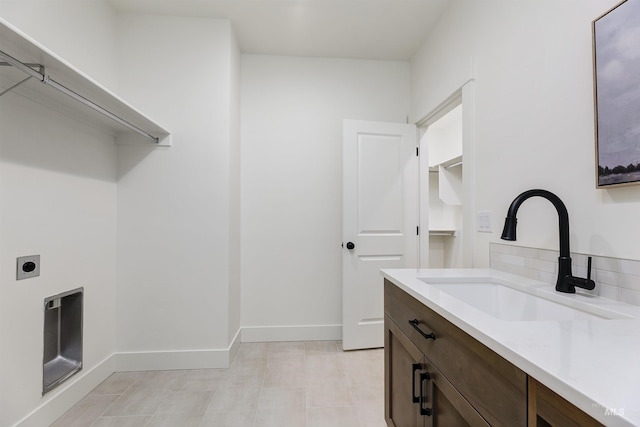 12507 S Lenora Pl, Nampa, ID 83686 - washroom featuring a sink, hookup for an electric dryer, and baseboards