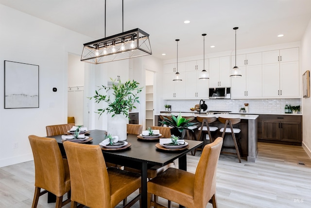 12507 S Lenora Pl, Nampa, ID 83686 - dining space featuring baseboards, light wood-style flooring, and recessed lighting