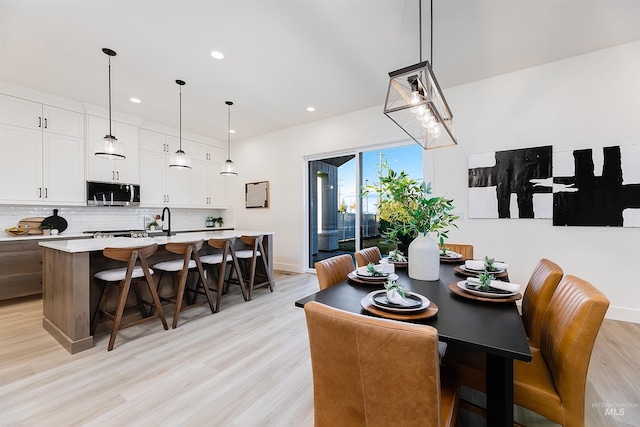 12507 S Lenora Pl, Nampa, ID 83686 - dining room featuring baseboards, light wood-style flooring, and recessed lighting