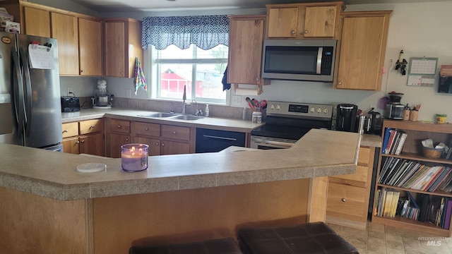 1455 S 2190 E, Malta, ID 83342 - kitchen featuring stainless steel appliances, a sink, light countertops, and brown cabinets