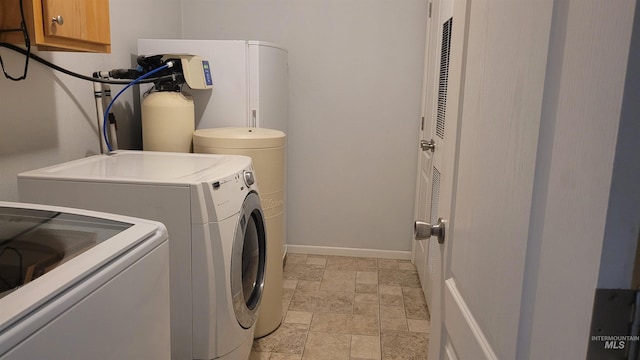 1455 S 2190 E, Malta, ID 83342 - washroom featuring separate washer and dryer, stone finish flooring, and baseboards