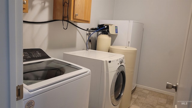 1455 S 2190 E, Malta, ID 83342 - washroom featuring washer and clothes dryer, baseboards, and stone finish flooring