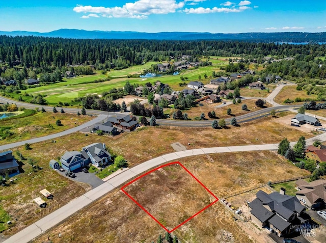 birds eye view of property with a mountain view