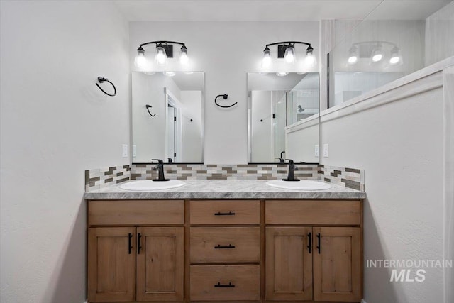 full bathroom featuring double vanity, a sink, and tasteful backsplash