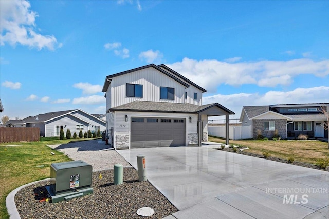 view of front of house featuring a garage, fence, a front yard, and concrete driveway