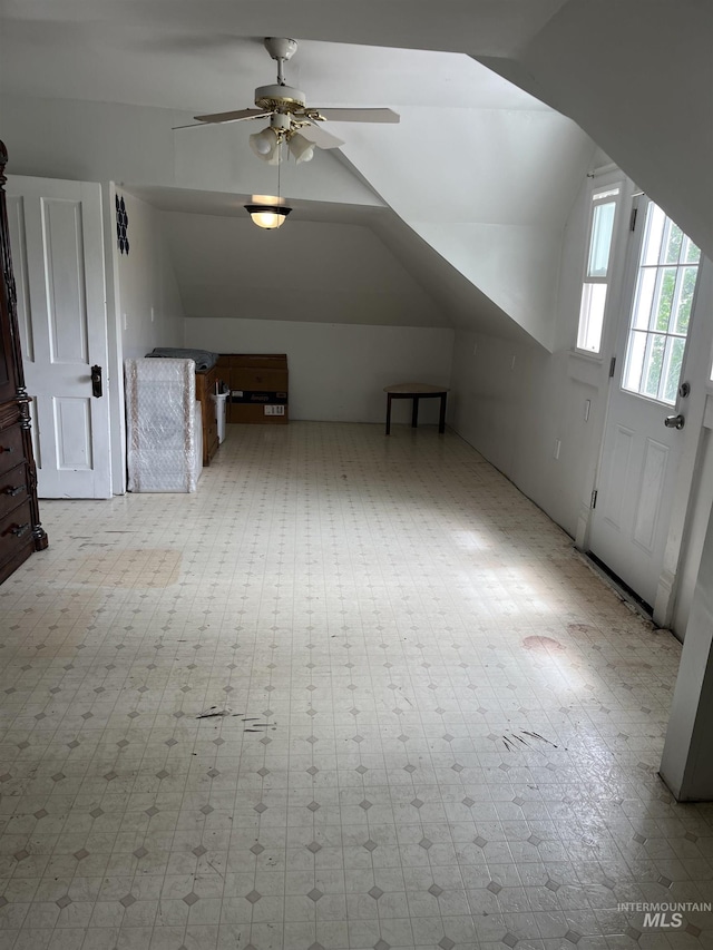 bonus room featuring lofted ceiling and ceiling fan