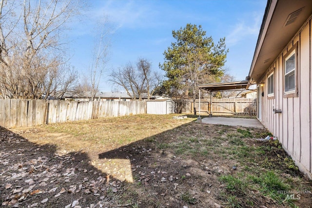 view of yard featuring an outbuilding and a fenced backyard