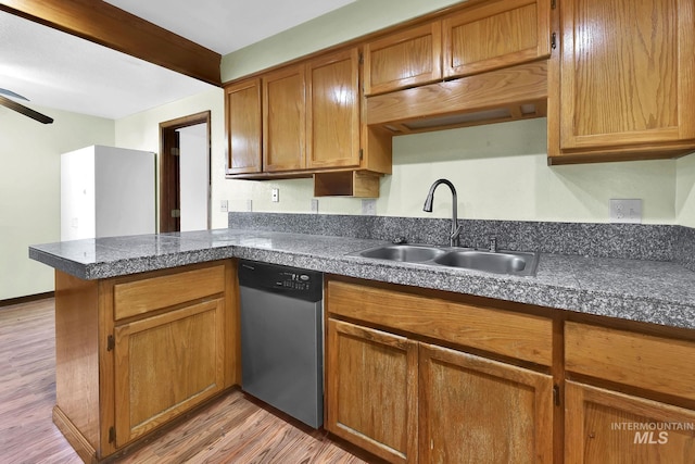 kitchen featuring beamed ceiling, dishwasher, sink, kitchen peninsula, and light wood-type flooring