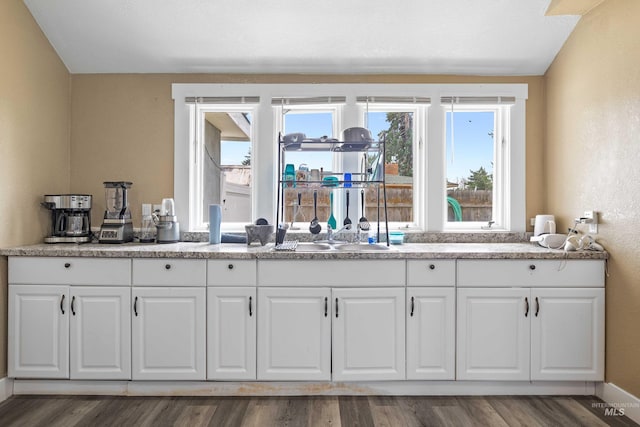 726 Wyoming St, Gooding, ID 83330 - interior space featuring a sink, baseboards, and wood finished floors