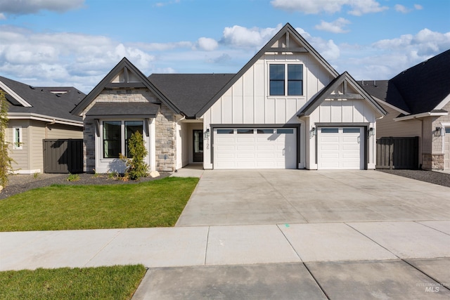 view of front facade with a garage and a front yard