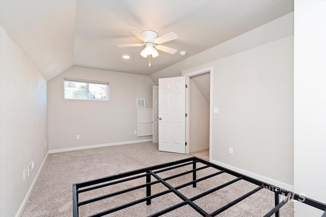 additional living space with baseboards, visible vents, lofted ceiling, a ceiling fan, and carpet floors