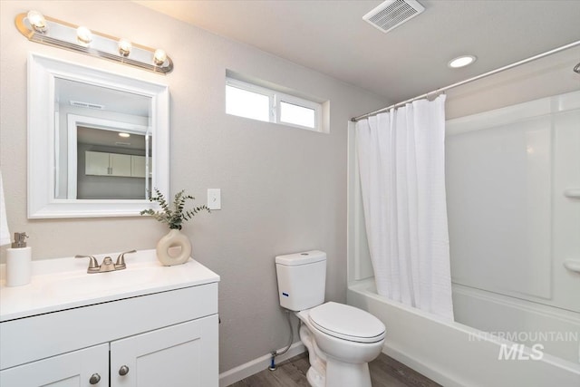 bathroom featuring shower / bath combination with curtain, wood finished floors, visible vents, toilet, and vanity