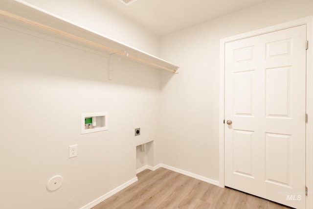 laundry area featuring laundry area, baseboards, hookup for a washing machine, light wood-style floors, and electric dryer hookup