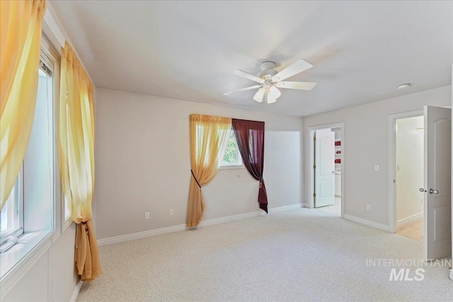 5130 N Lakemont Ln, Garden City, ID 83714 - empty room with light carpet, ceiling fan, and baseboards