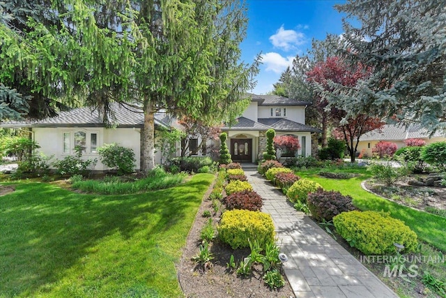 5130 N Lakemont Ln, Garden City, ID 83714 - obstructed view of property featuring a front yard and stucco siding