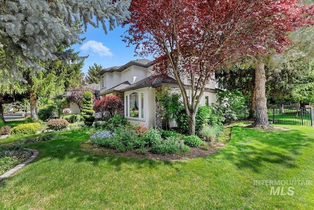 5130 N Lakemont Ln, Garden City, ID 83714 - view of property exterior with stucco siding and stone siding