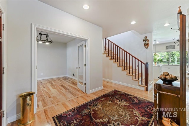5130 N Lakemont Ln, Garden City, ID 83714 - entryway featuring wood finished floors, stairway, baseboards, and recessed lighting