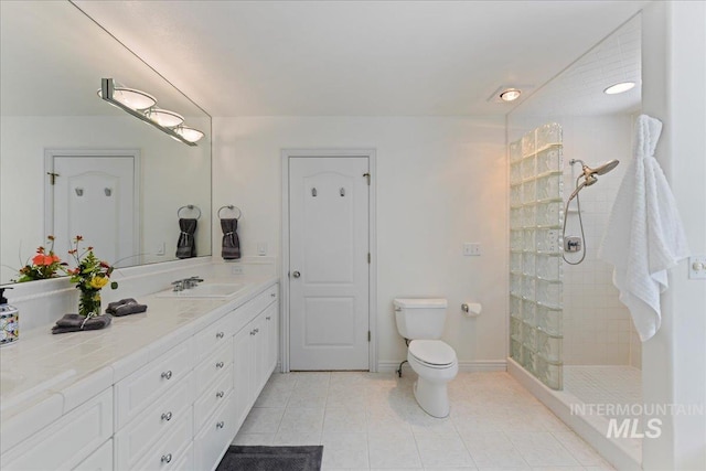 5130 N Lakemont Ln, Garden City, ID 83714 - bathroom with walk in shower, tile patterned flooring, toilet, vanity, and baseboards