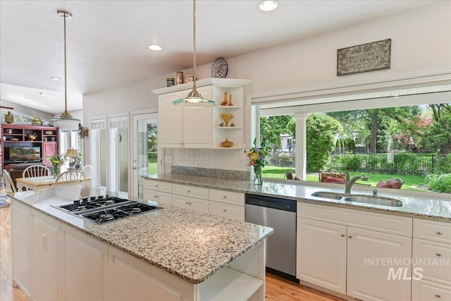 5130 N Lakemont Ln, Garden City, ID 83714 - kitchen with dishwasher, open shelves, stovetop with downdraft, a sink, and a center island