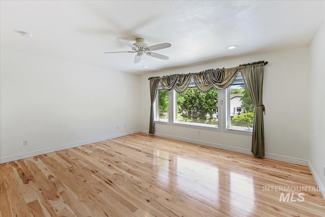 5130 N Lakemont Ln, Garden City, ID 83714 - unfurnished room with a ceiling fan, baseboards, and wood finished floors