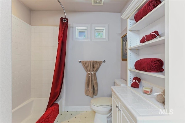 5130 N Lakemont Ln, Garden City, ID 83714 - bathroom with toilet, baseboards, and shower / bath combo
