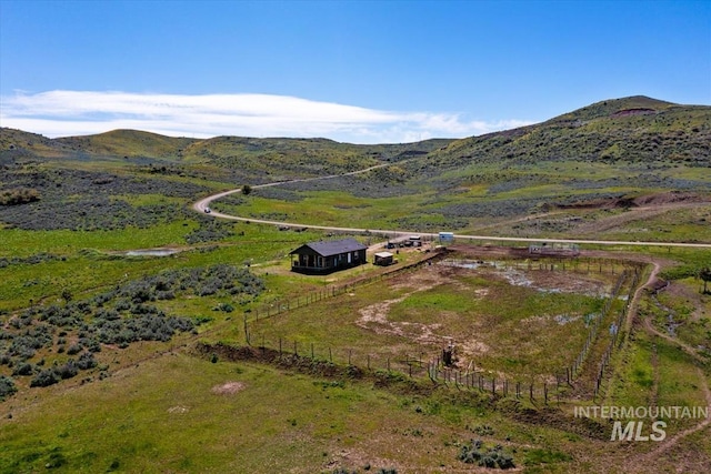 aerial view with a mountain view and a rural view