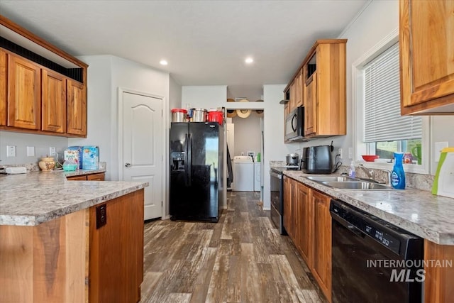 1639 Cuddy View Dr, Council, ID 83612 - kitchen featuring washer / clothes dryer, dark hardwood / wood-style flooring, sink, and black appliances