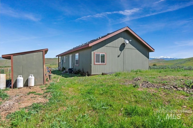 1639 Cuddy View Dr, Council, ID 83612 - view of side of property featuring a mountain view and a lawn