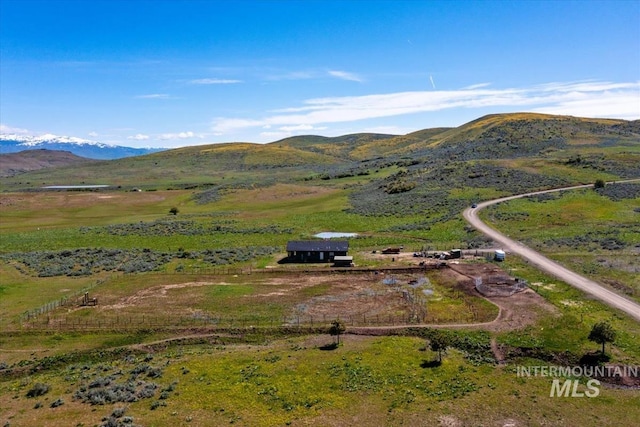 aerial view featuring a mountain view and a rural view