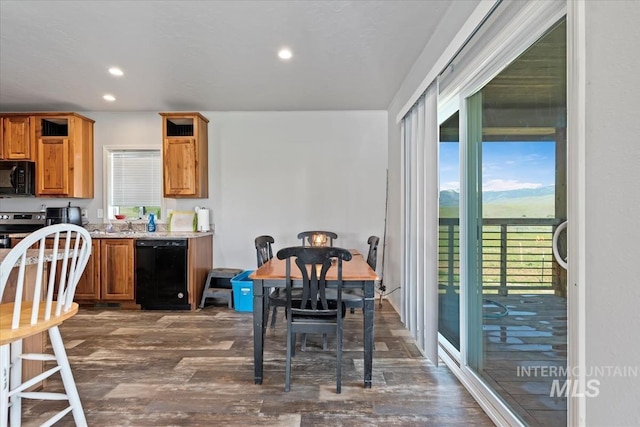 1639 Cuddy View Dr, Council, ID 83612 - kitchen with dark hardwood / wood-style flooring, light stone countertops, black appliances, and sink