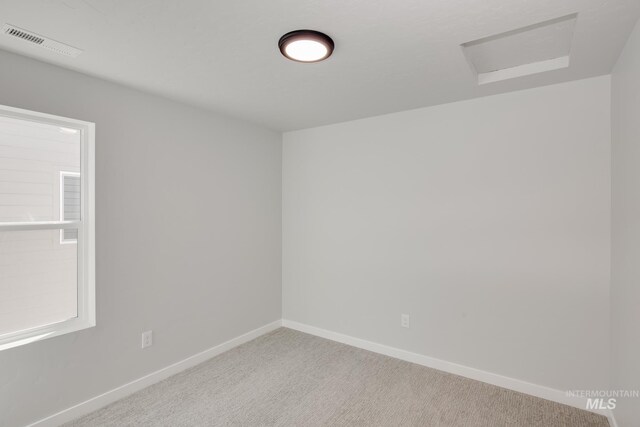4364 N Glassford Ave, Meridian, ID 83646 - unfurnished room with visible vents, attic access, baseboards, and carpet