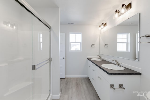 4364 N Glassford Ave, Meridian, ID 83646 - full bathroom featuring a healthy amount of sunlight, a stall shower, and a sink