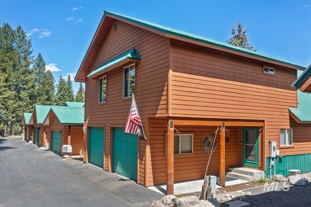 1425 Clements Rd Unit 5, Mccall, ID 83638 - view of side of home featuring metal roof and a garage