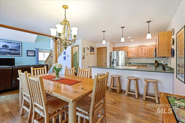 1425 Clements Rd Unit 5, Mccall, ID 83638 - dining area with wood finished floors, a chandelier, and recessed lighting