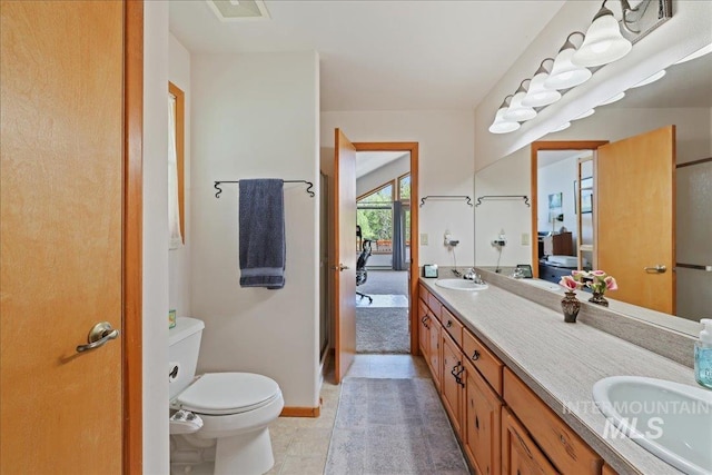 1425 Clements Rd Unit 5, Mccall, ID 83638 - full bath featuring toilet, double vanity, baseboards, and tile patterned floors