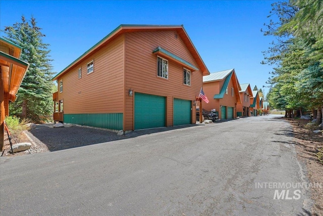 1425 Clements Rd Unit 5, Mccall, ID 83638 - view of home's exterior with a garage and driveway
