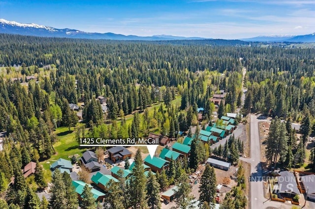 1425 Clements Rd Unit 5, Mccall, ID 83638 - drone / aerial view of a heavily wooded area and a mountain backdrop