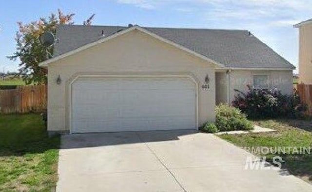 601 Syringa Way, Caldwell, ID 83605 - ranch-style house with a garage and concrete driveway