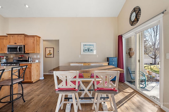 dining area with dark hardwood / wood-style floors